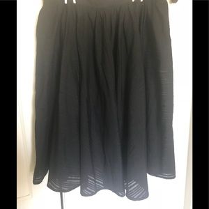 Black flow skirt with under skirt.